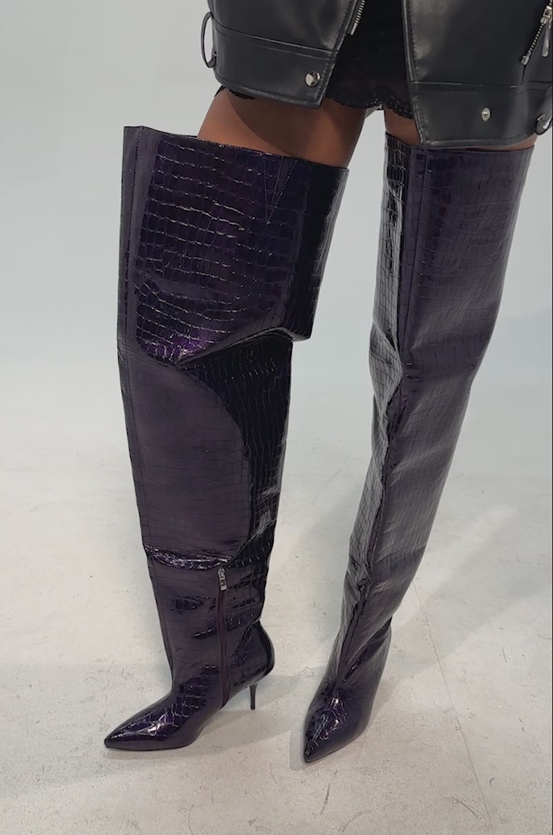 Video of woman modeling the AZALEA WANG HALINA DARK PURPLE CROC STILETTO BOOTS, a short black lace dress, and a black leather jacket