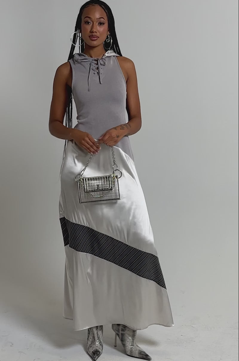 A video of a woman wearing the BONDI PATCHWORK HOODED MAXI DRESS.