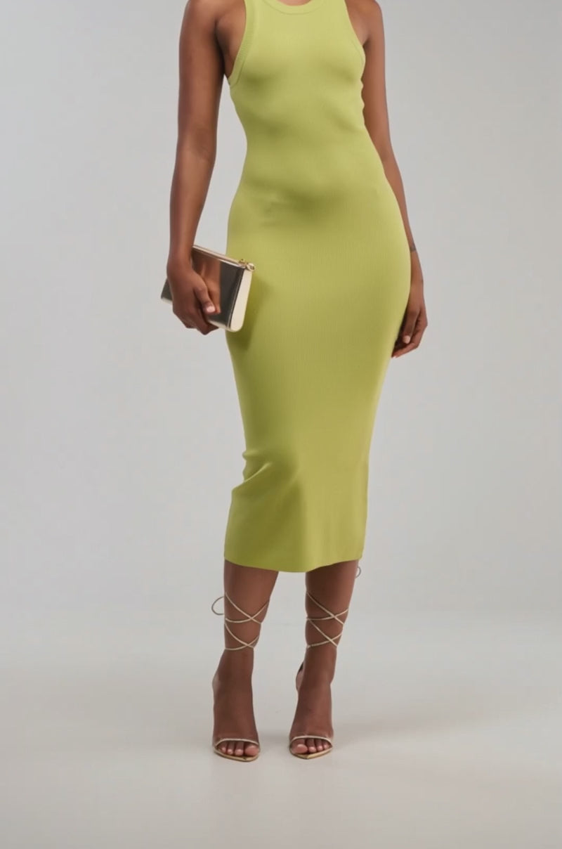 Video of a woman modeling the CUTIE PIE KNIT MIDI DRESS IN CHARTREUSE. 