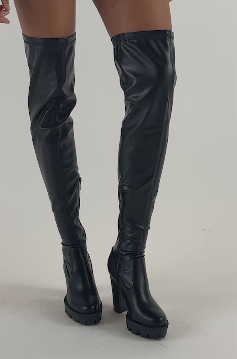 Video of a woman modeling the AZALEA WANG ASHLAND BOOT IN BLACK featuring chunky platform heels.