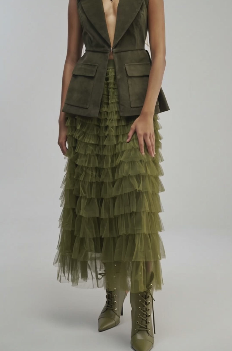 Video of a woman modeling the STARS ALIGNED MESH RUFFLE MAXI SKIRT in olive green, featuring an A-line silhouette and layered tulle inner lining.