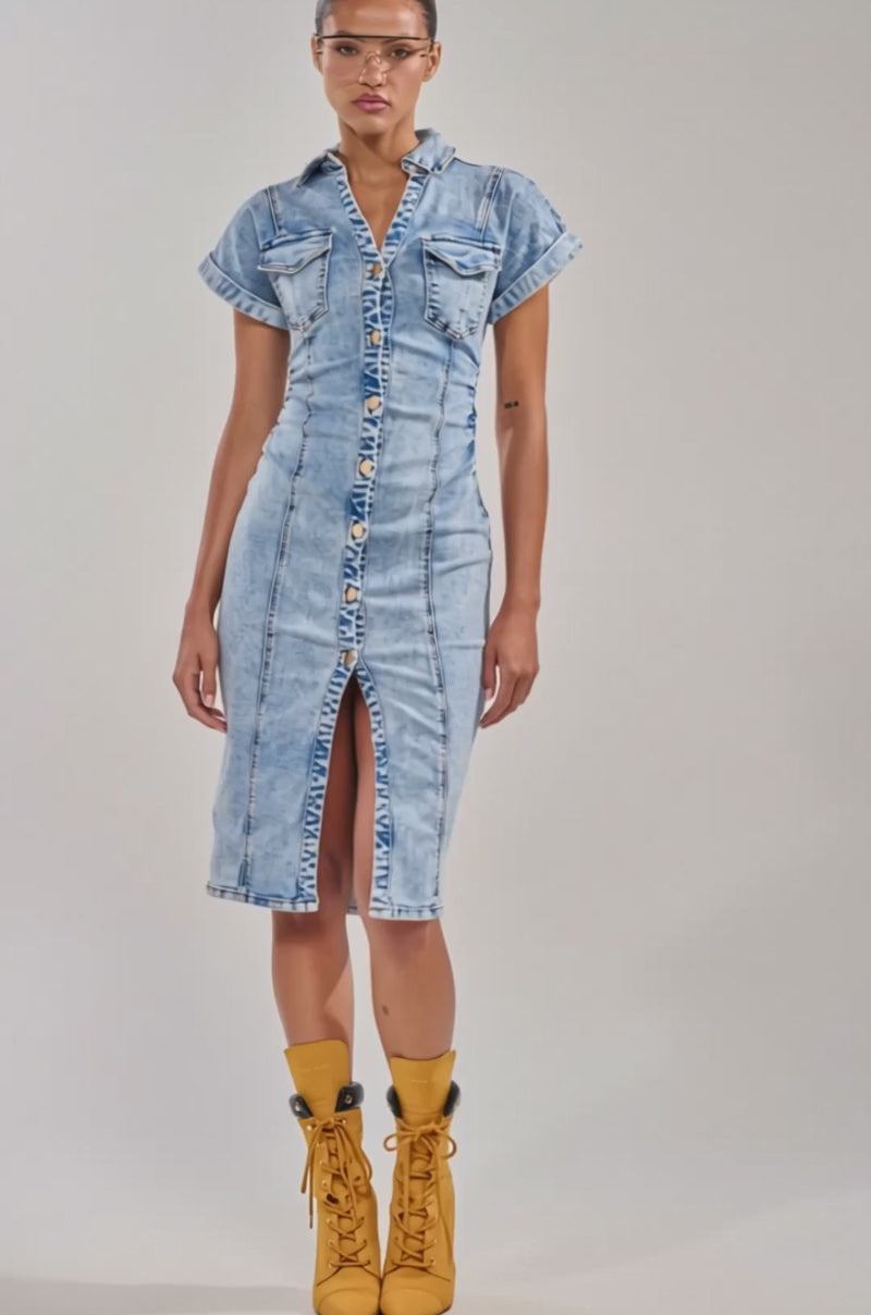 A video of a person wearing the LITTLE DENIM MIDI DRESS IN LIGHT BLUE featuring a curve-hugging fit and front slit, styled with yellow lace-up ankle boots.