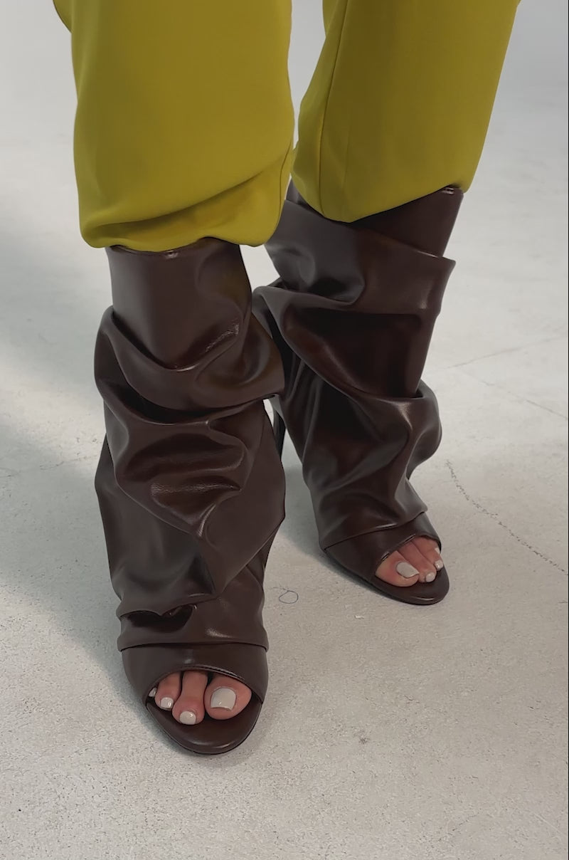 A video of a person wearing the AZALEA WANG APEX BROWN SLOUCHY OPEN TOE BOOTIE.