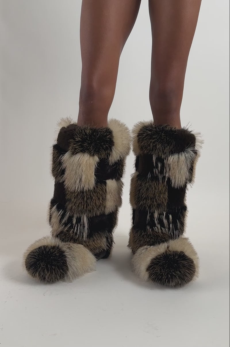 Video of a woman modeling the AKIRA GOLD FENNEC BLACK BROWN PATCH WORK FLAT BOOT.