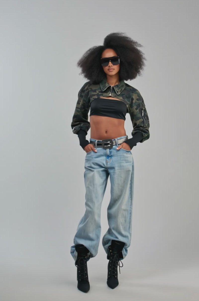 Video of a woman modeling the NOW YOU SEE ME CAMO BOLERO.