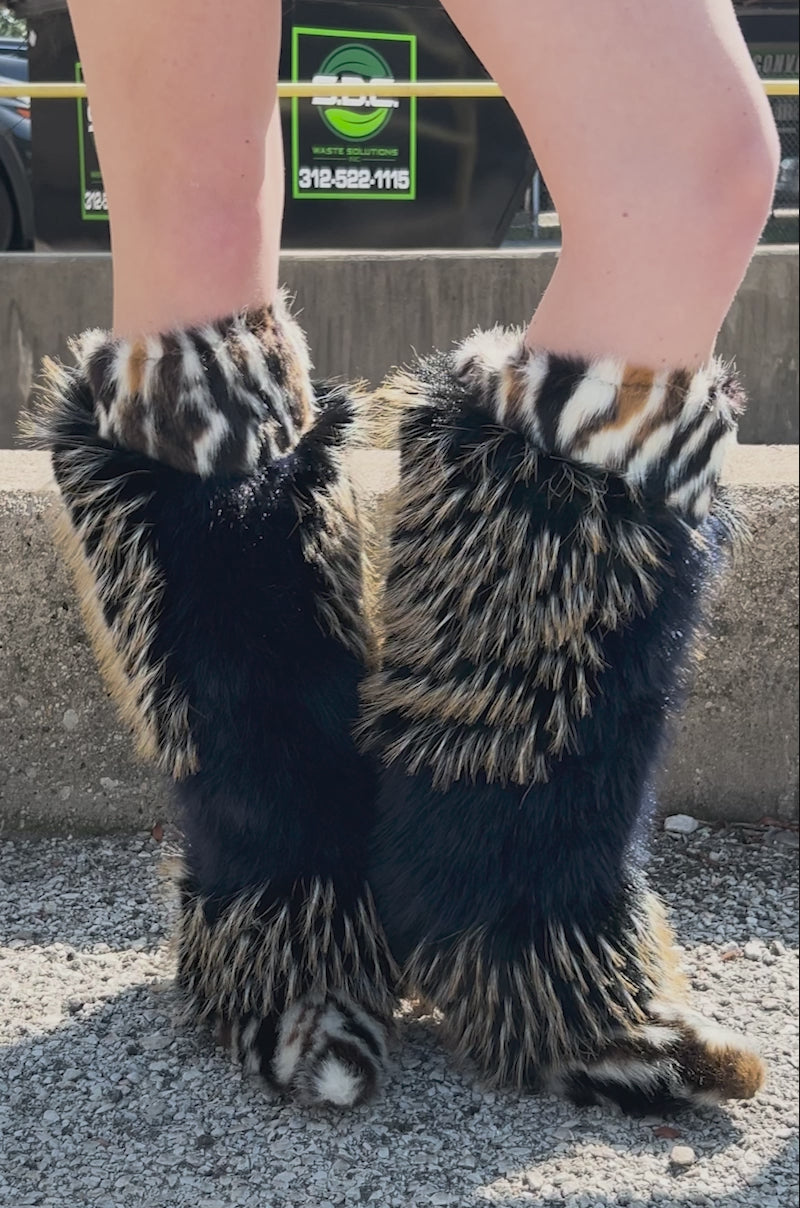 Video of person modeling the AZALEA WANG UPENDO NAVY MULTI FUR BOOT featuring a pointed toe and unique furry print