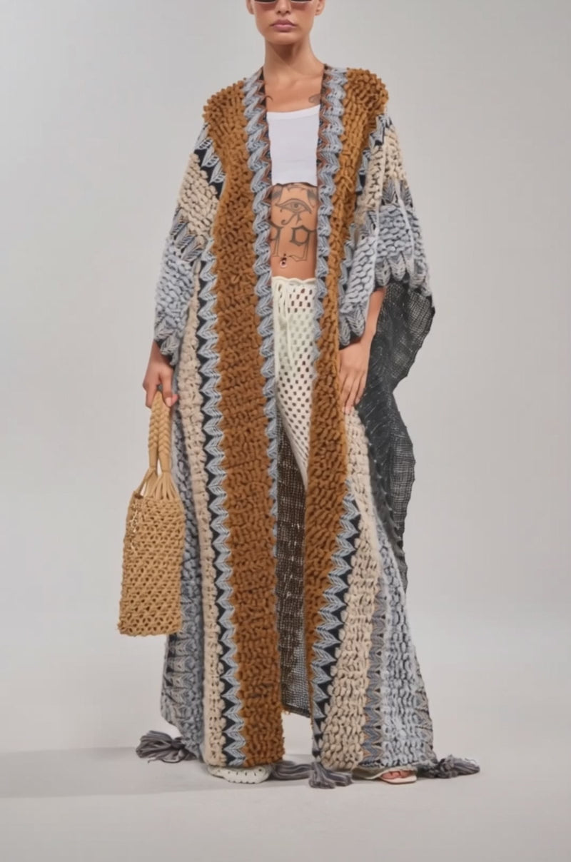 Video of woman modeling the CRAZY FOR YOU CARDIGAN in brown, gray, and black stripes, holding a matching textured bag.