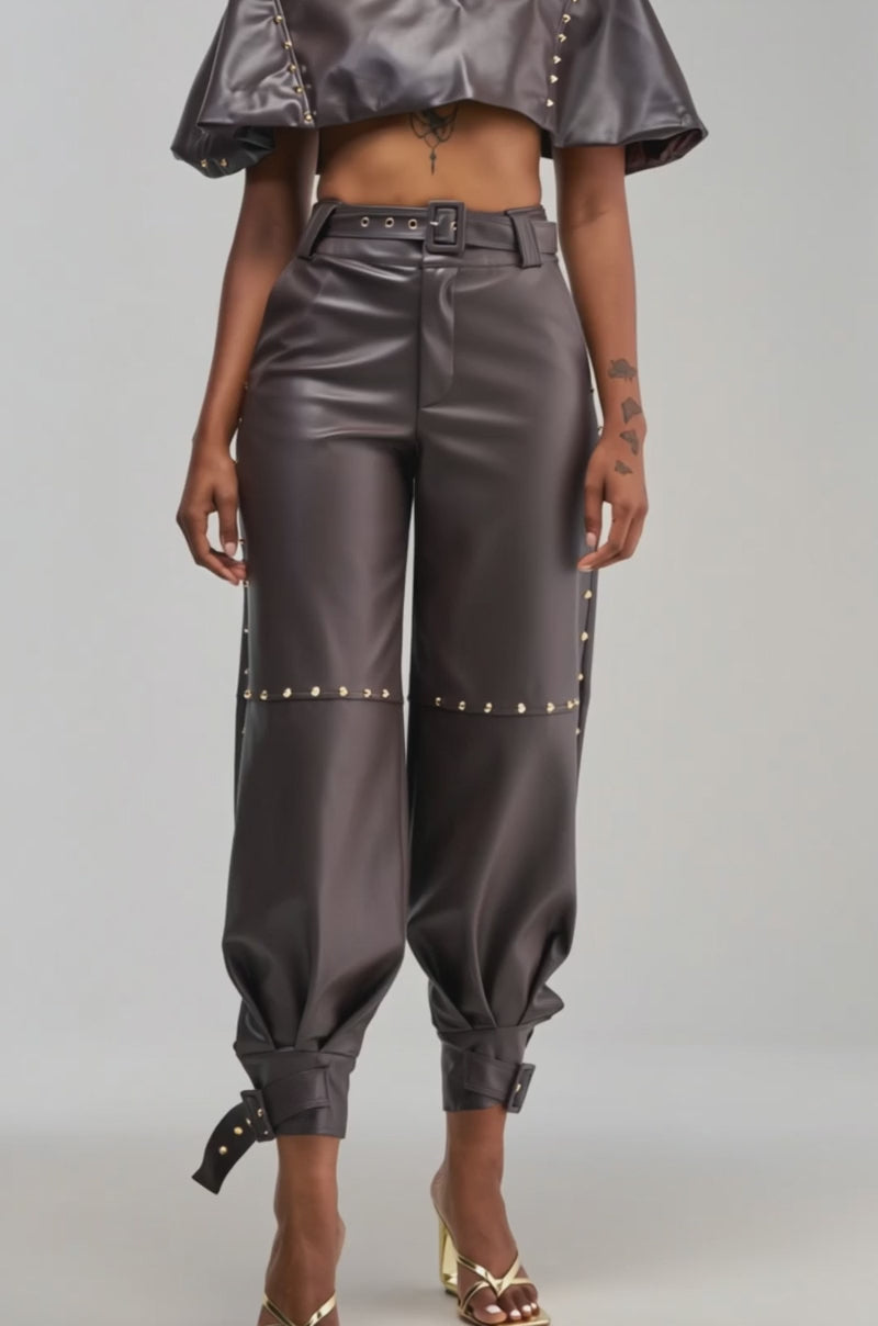 Video of a woman modeling the STUDDED FAUX LEATHER BELTED PANT IN DARK CHOCOLATE.