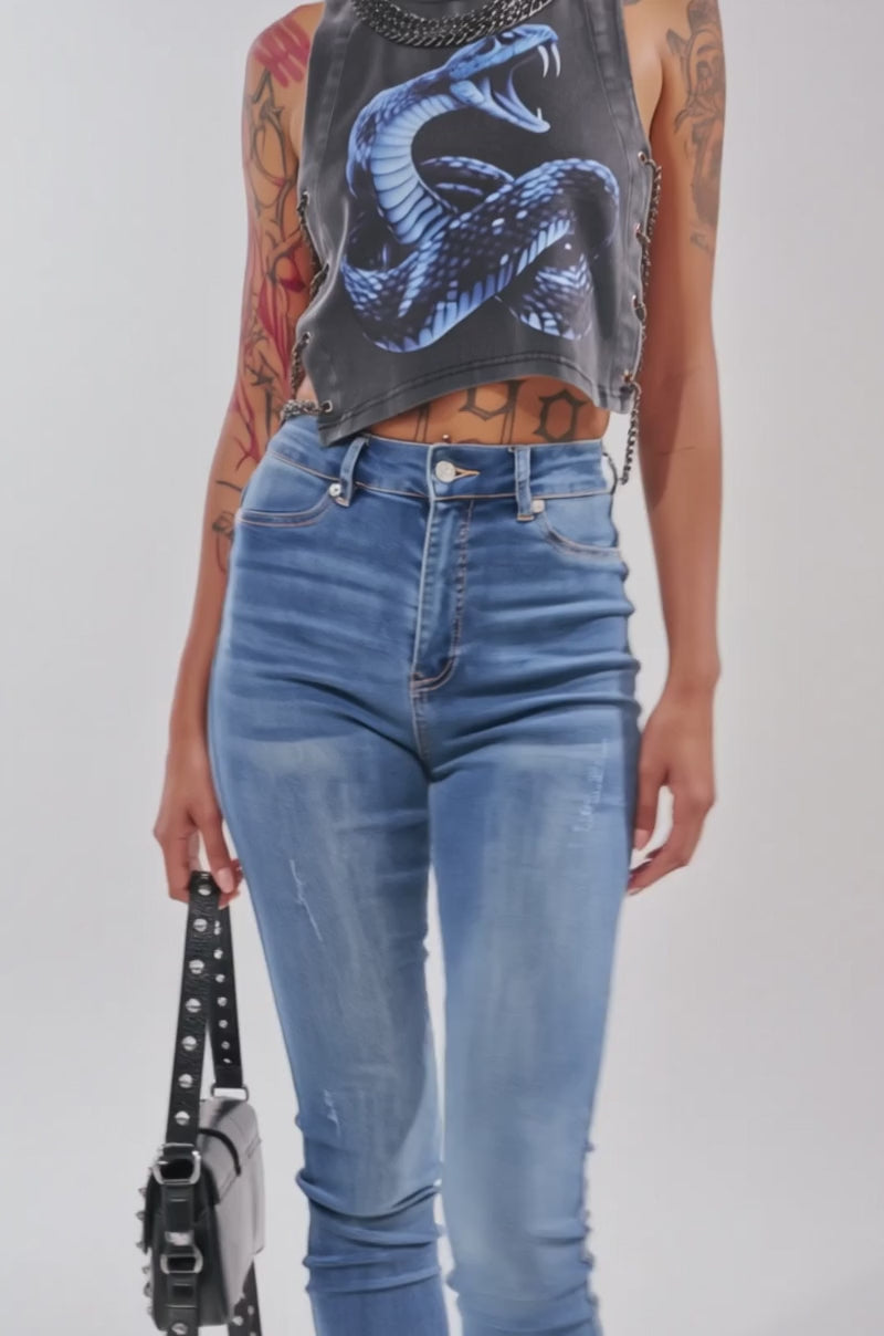 Video of woman modeling the HISS HISS CHAIN DETAIL TANK, featuring a bold blue snake graphic and chain link detailing.