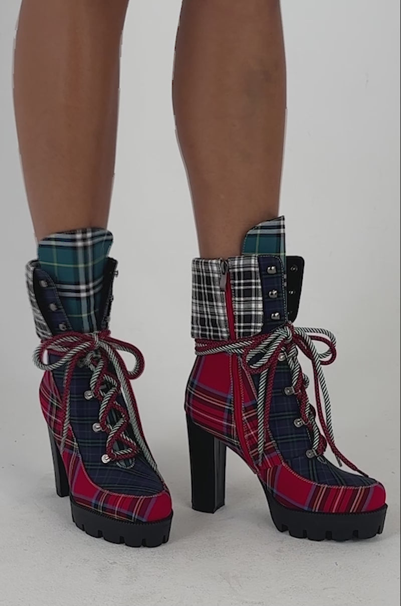 Video of a woman modeling the AZALEA WANG KNICKERBOCKER MULTI PLAID PATCHWORK BLOCK BOOTIE.