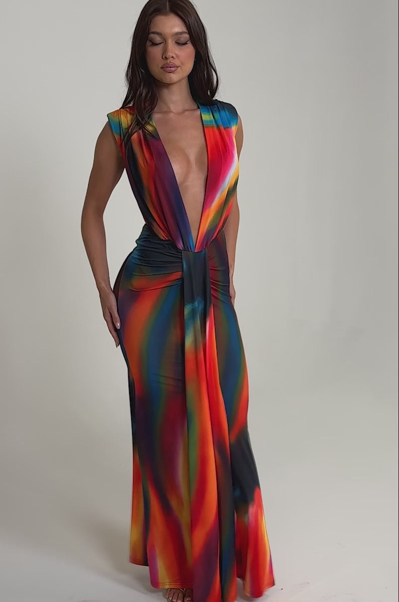 Video of woman modeling the COLOR ME IMPRESSED MAXI DRESS featuring an abstract print and a plunging neckline.