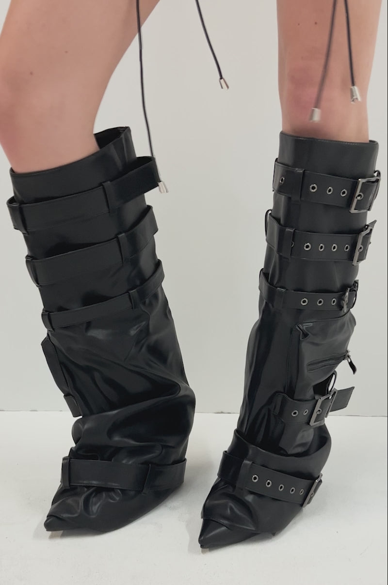 Video of person showing off the AZALEA WANG NEMIANA BLACK BELT AND BUCKLES DETAIL BOOT—oversized knee-high boots featuring multiple buckles and straps.