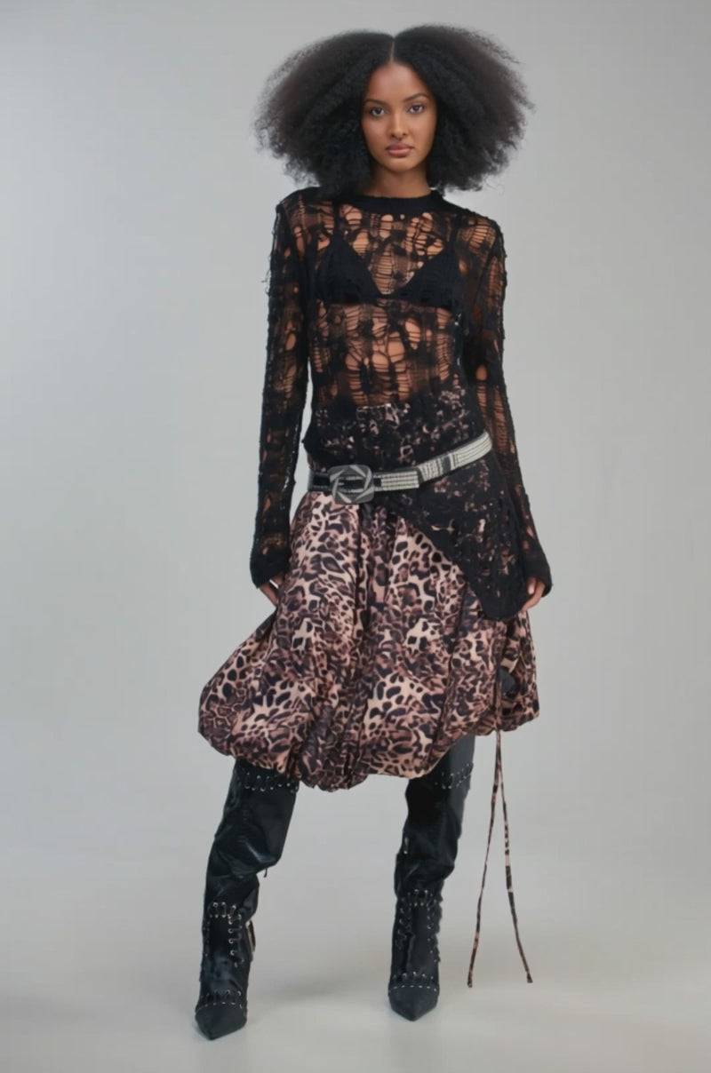 Video of a woman modeling the CHEETAH GIRL CHEETAH SISTER MIDI SKIRT—a voluminous cheetah print bubble skirt with adjustable tie details.