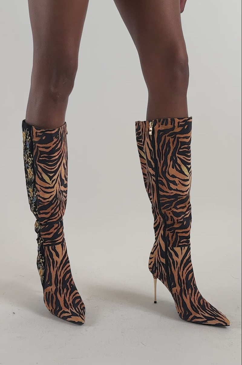 Video of a woman modeling the AZALEA WANG TULANE TIGER AND FLORAL STILETTO BOOT.