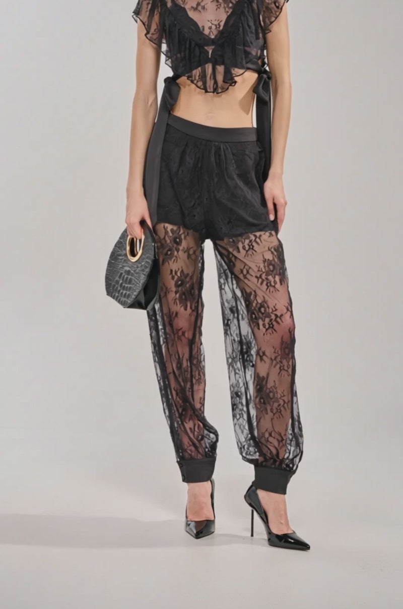 Video of woman modeling the LACED IN LOVE LACE BALLOON PANT—a sheer black lace pant