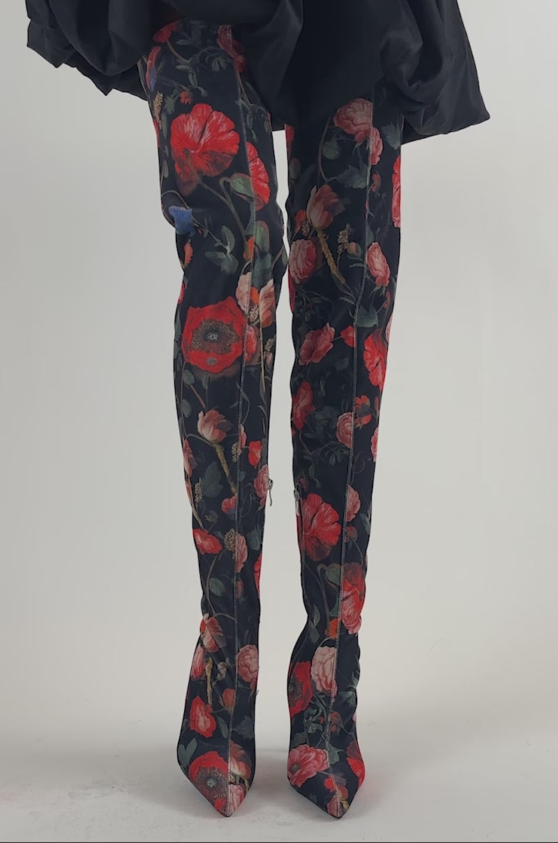 Video of a woman modeling the AZALEA WANG BERENICE BLACK FLORAL STILETTO BOOTS—thigh-high boots featuring a striking bold red floral pattern.