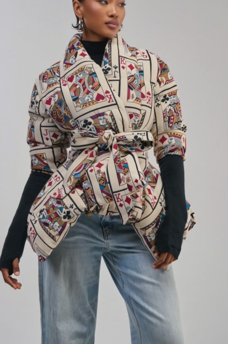Video of a woman modeling the SHOW YOUR CARDS TAPESTRY PEPLUM PUFFER.