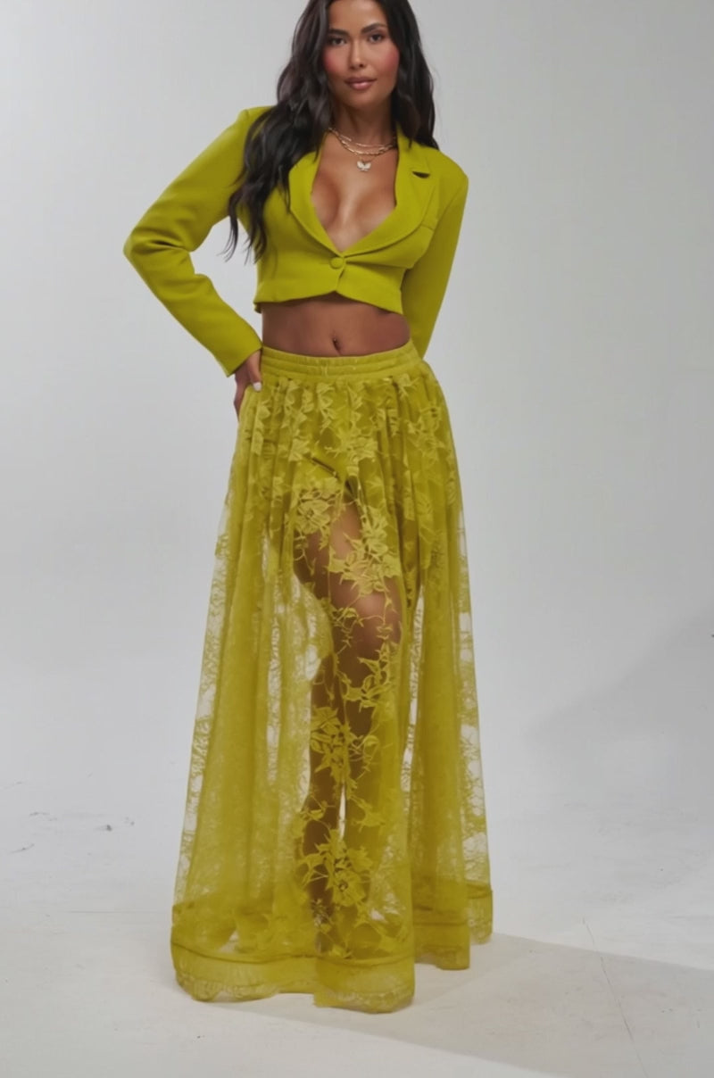 Video of woman modeling the CAN I KICK IT CROPPED BLAZER in chartreuse with a deep neckline, styled with a matching sheer lace skirt.
