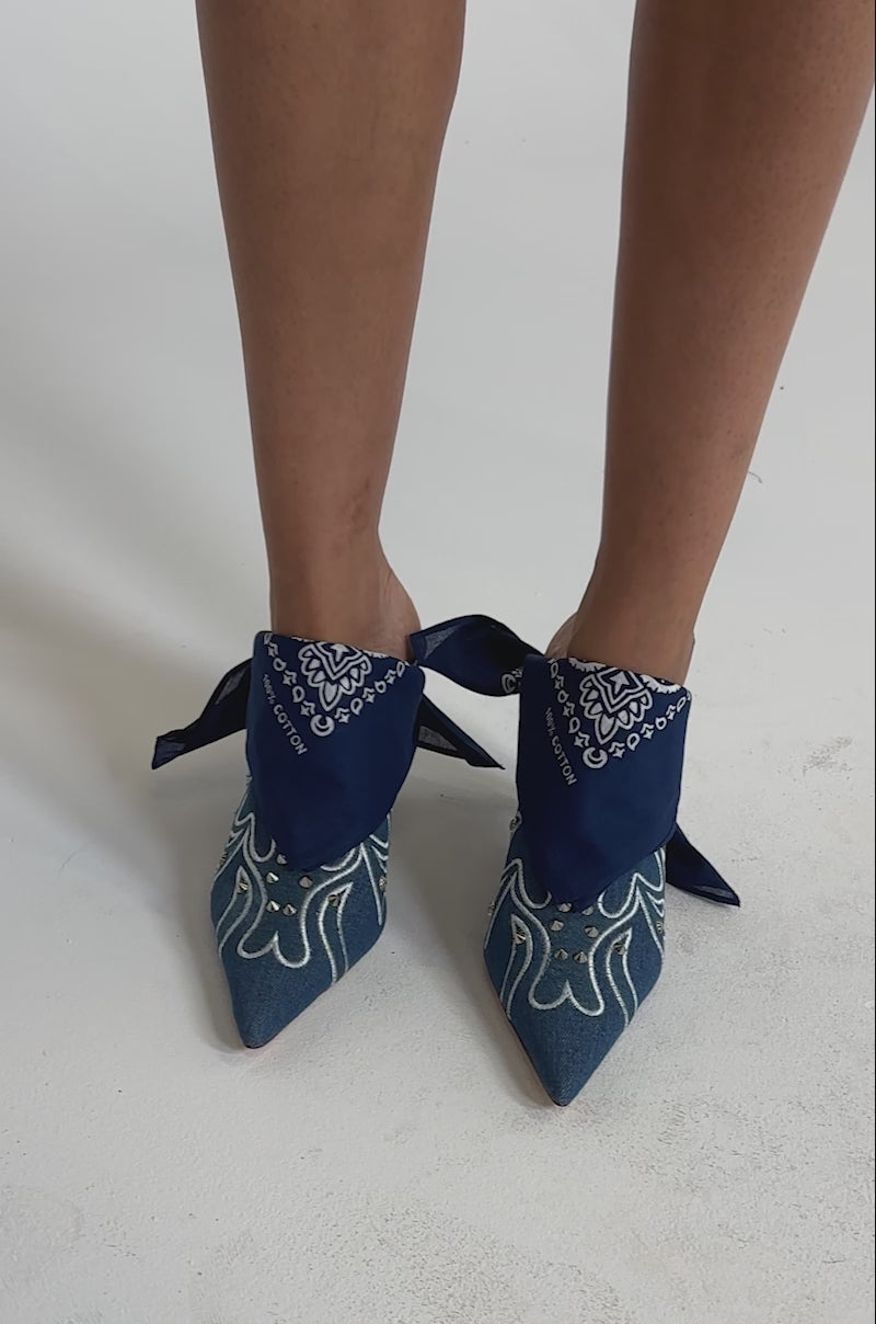 A video of a person wearing the AZALEA WANG TAVINE DENIM MULE PUMP WITH BANDANA DETAIL.
