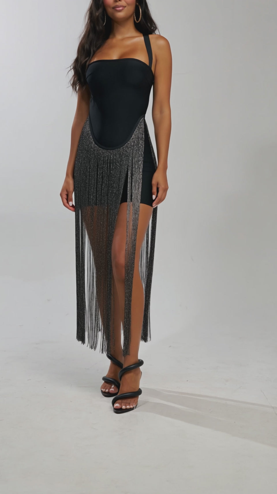 Video of woman modeling NO RULES BANDAGE MAXI DRESS WITH FRINGE IN BLACK.