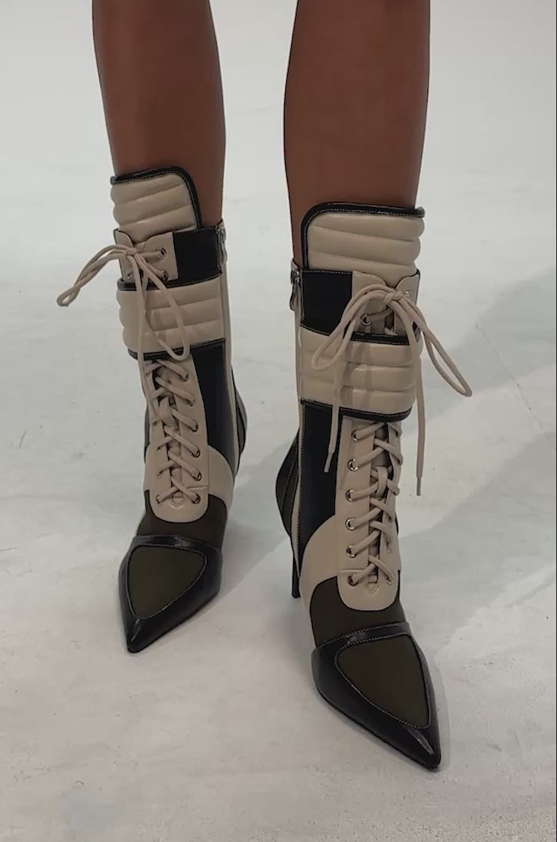 Video of woman modeling the AZALEA WANG AMADA OLIVE COLORBLOCKED SPORTY BOOTIE—stylish pointed, high-heeled lace-up boots in beige, black, and olive green