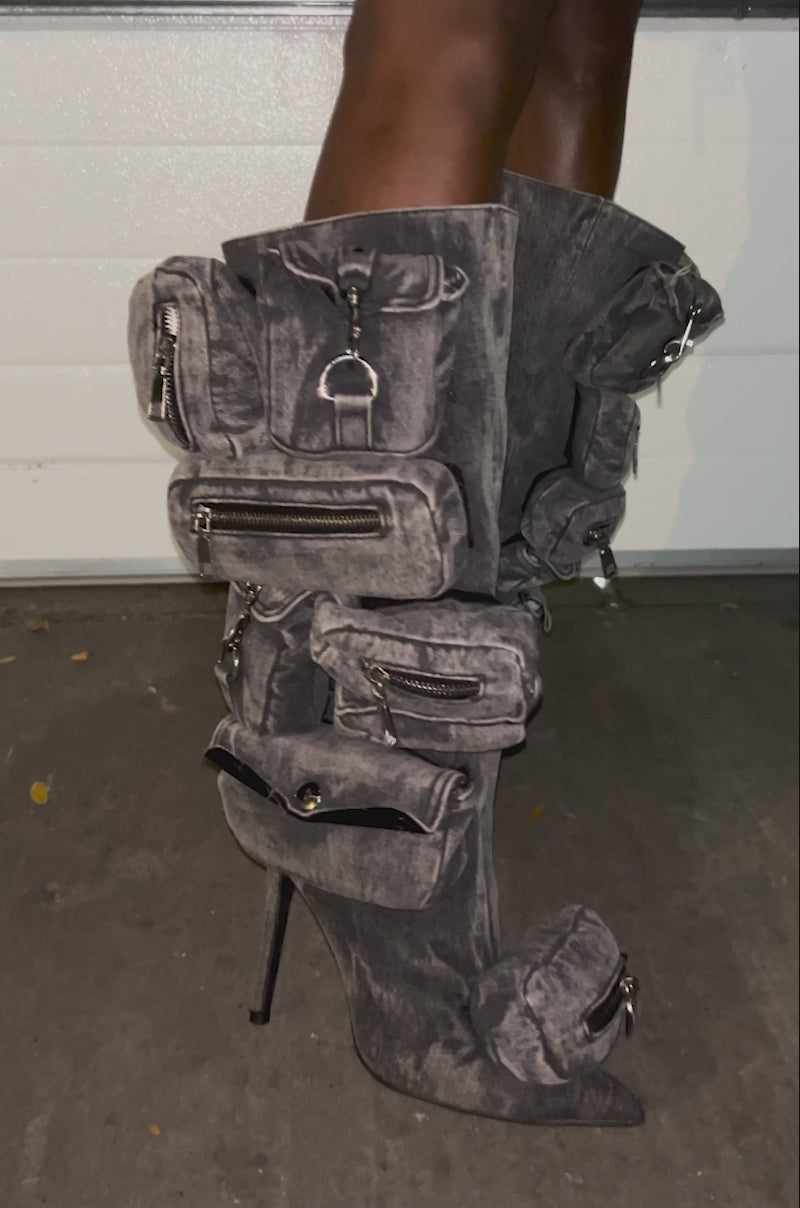 Video of woman modeling the AZALEA WANG PRAVIN BLACK POCKET DETAIL STILETTO BOOTS, highlighting the unique thigh-high, pocketed stiletto boots with zippers.