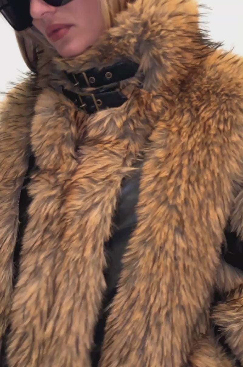 Video of a woman modeling the RIKKI PANELED FAUX FUR coat.