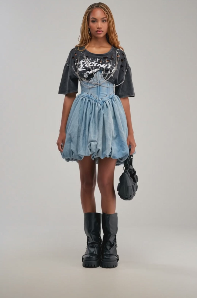 Video of a woman modeling the COOL GIRLS ONLY MINI DRESS layered over a black graphic t-shirt and accessorized with a black handbag.