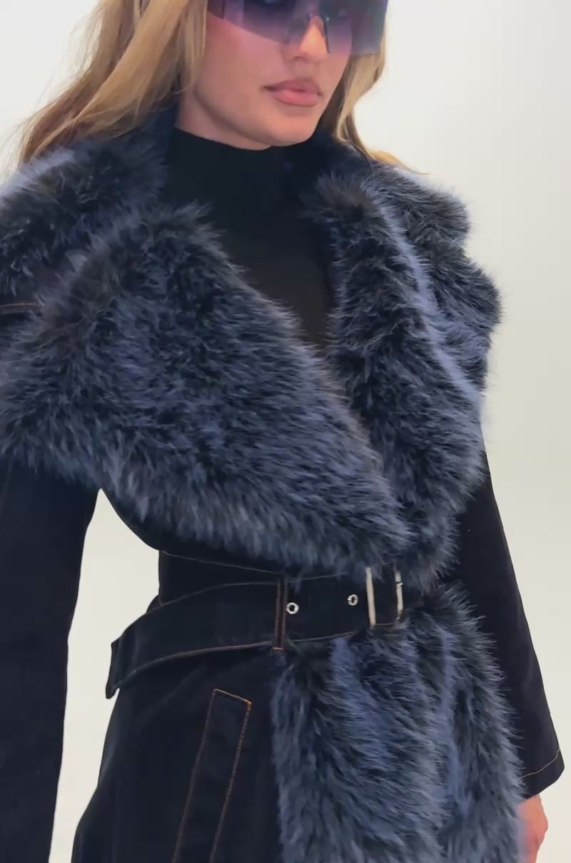 Video of a woman modeling THE BLUEPRINT VELVET DENIM TRENCH.