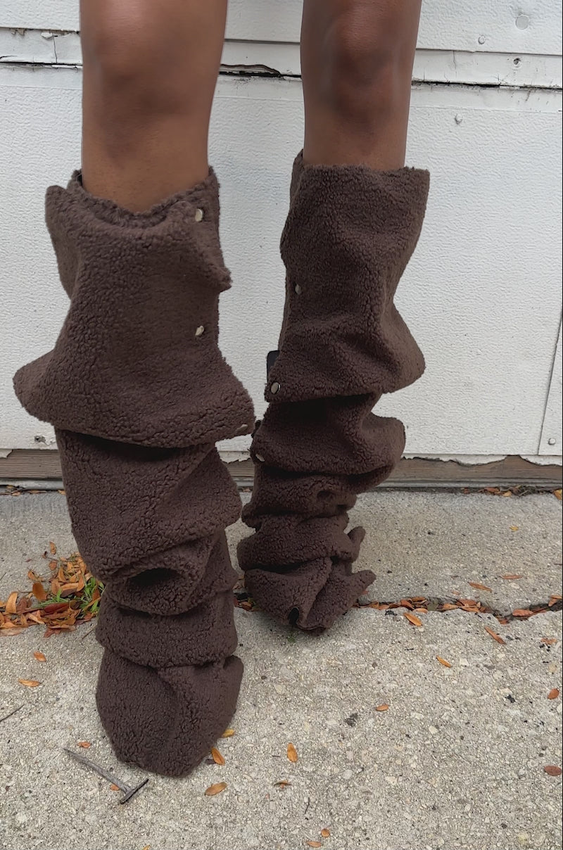 A video of a person wearing the AZALEA WANG FABIAN BROWN SHERPA FOLDED DETAIL BOOT.