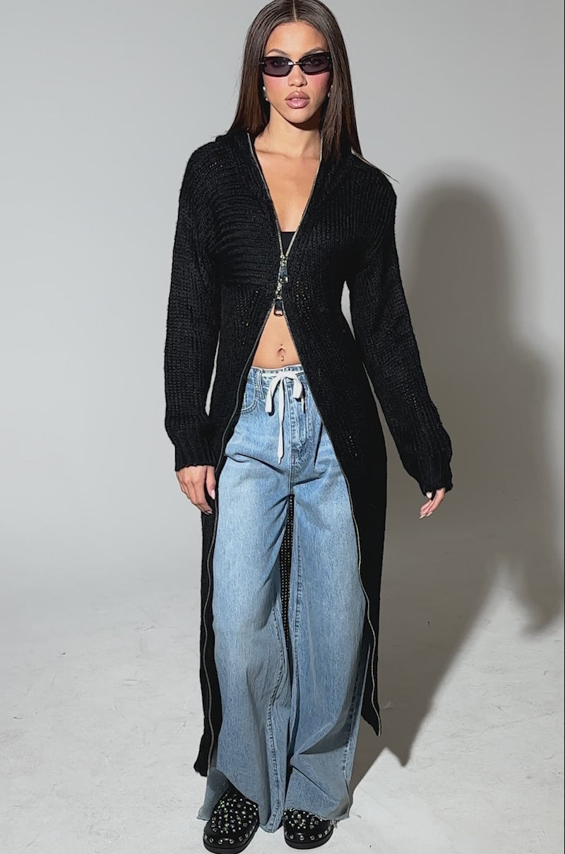 Video of woman modeling the COZIEST GIRLY ZIP UP SWEATER 