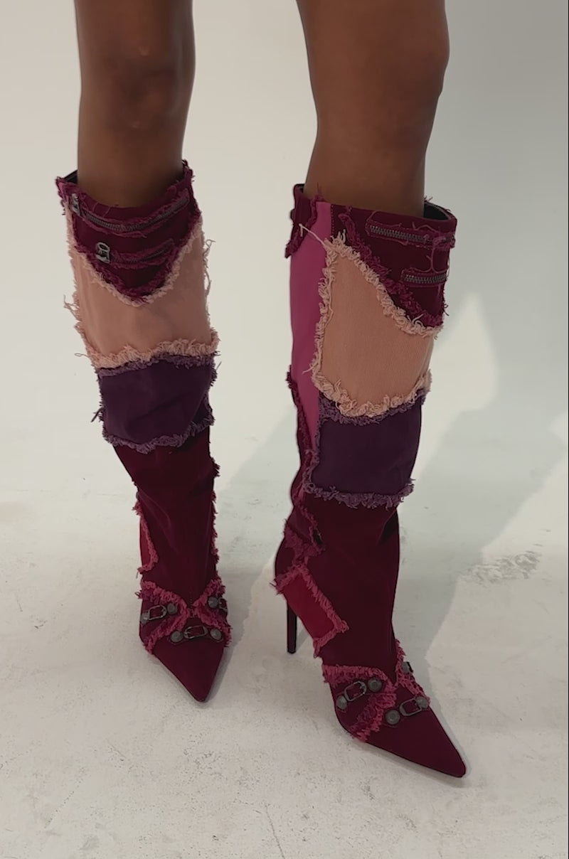 Video of a woman modeling the AKIRA GOLD AETHERA PINK MULTI PATCHWORK DENIM STILETTO BOOT—with knee-high, high-heeled style, pink patchwork denim, and decorative buttons.