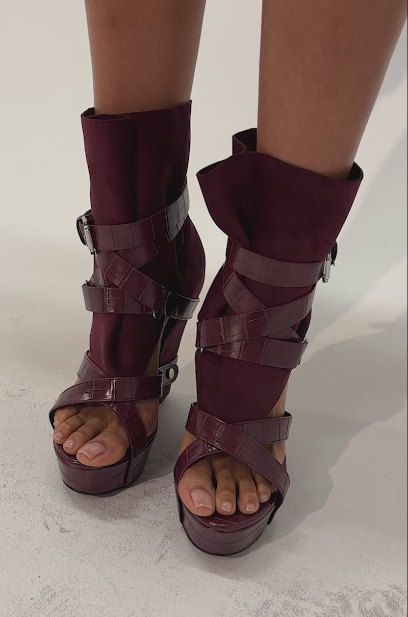 Video of a woman modeling the AZALEA WANG ROTHKO WEDGE SANDAL IN PLUM, showcasing the boho-chic style of these burgundy platform sandals, featuring chunky straps and buckles.