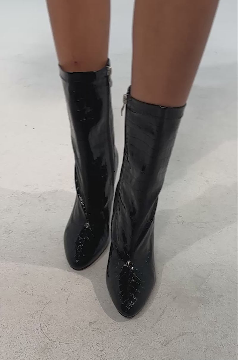 Video of woman modeling the AZALEA WANG WINGROVE BLACK BLOCK HEEL CROCODILE BOOTIE