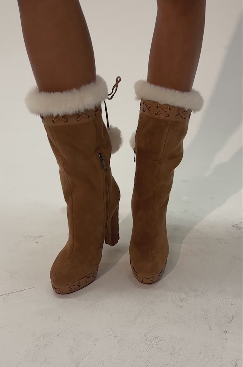 Video of a woman modeling the AZALEA WANG KATO CHESTNUT WHIP STITCH BLOCK BOOTIE, featuring chic chestnut suede, white faux fur lining, side laces, and playful pom-poms.
