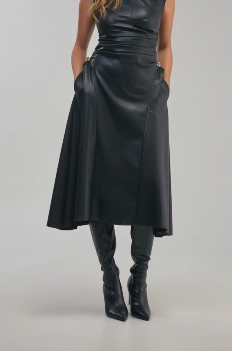 Video of a woman modeling the IT’S MY TIME MIDI DRESS IN BLACK PU LEATHER.
