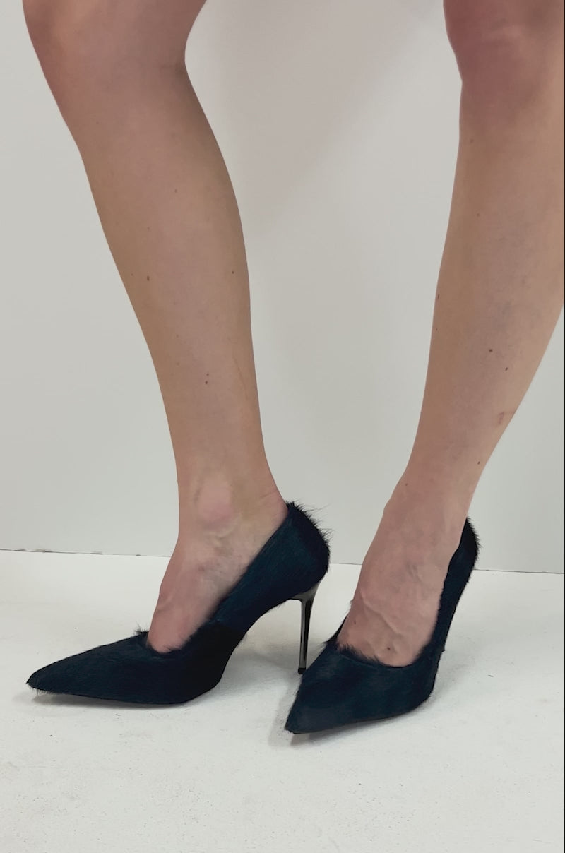 Video of person modeling all angles of the AZALEA WANG ROSEE NAVY PONY HAIR PUMPS with pointed toes and stiletto heels. 