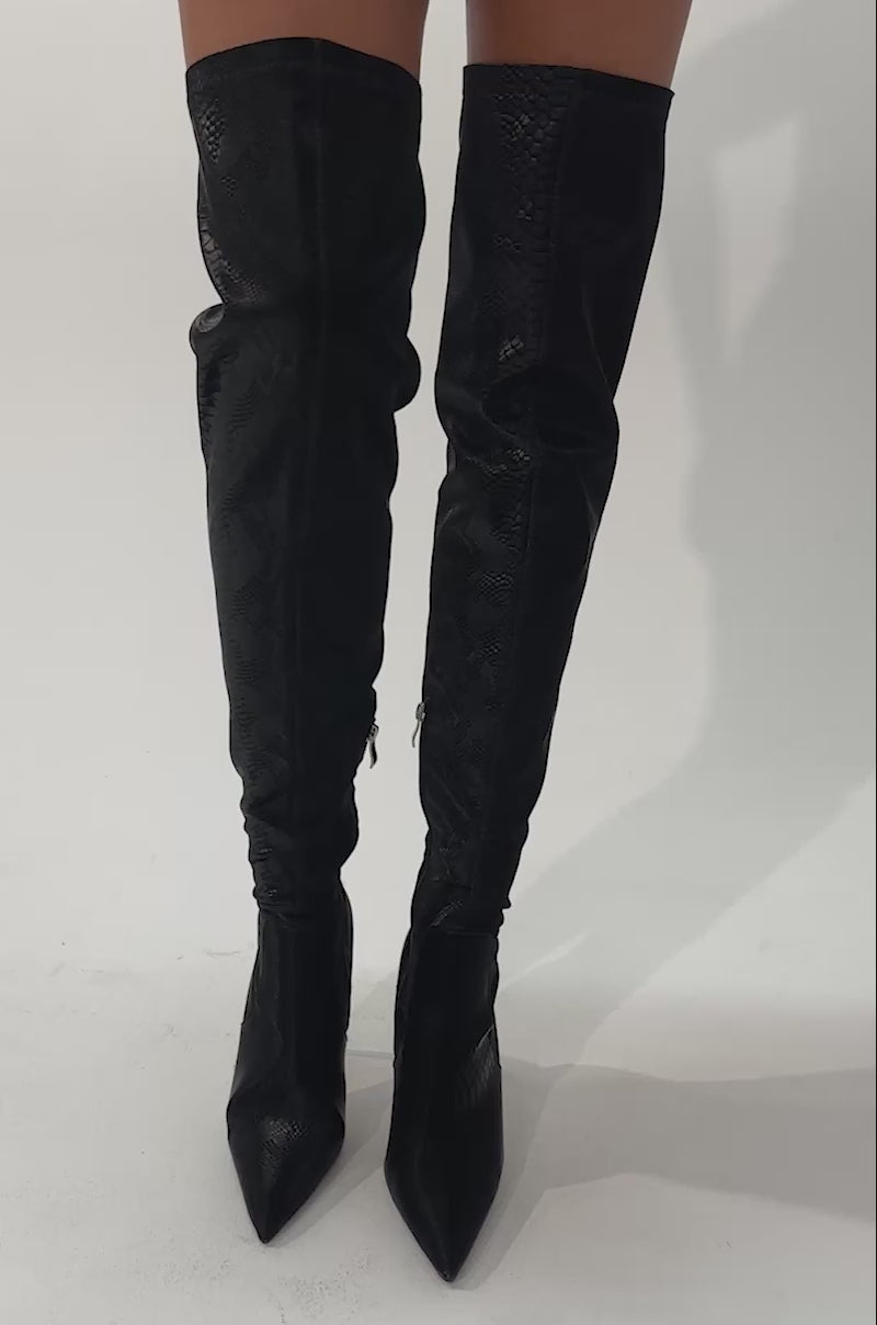 Video of a woman modeling the AZALEA WANG INGENUE BLACK SNAKE OVER THE KNEE STRETCH PU STILETTO BOOT.