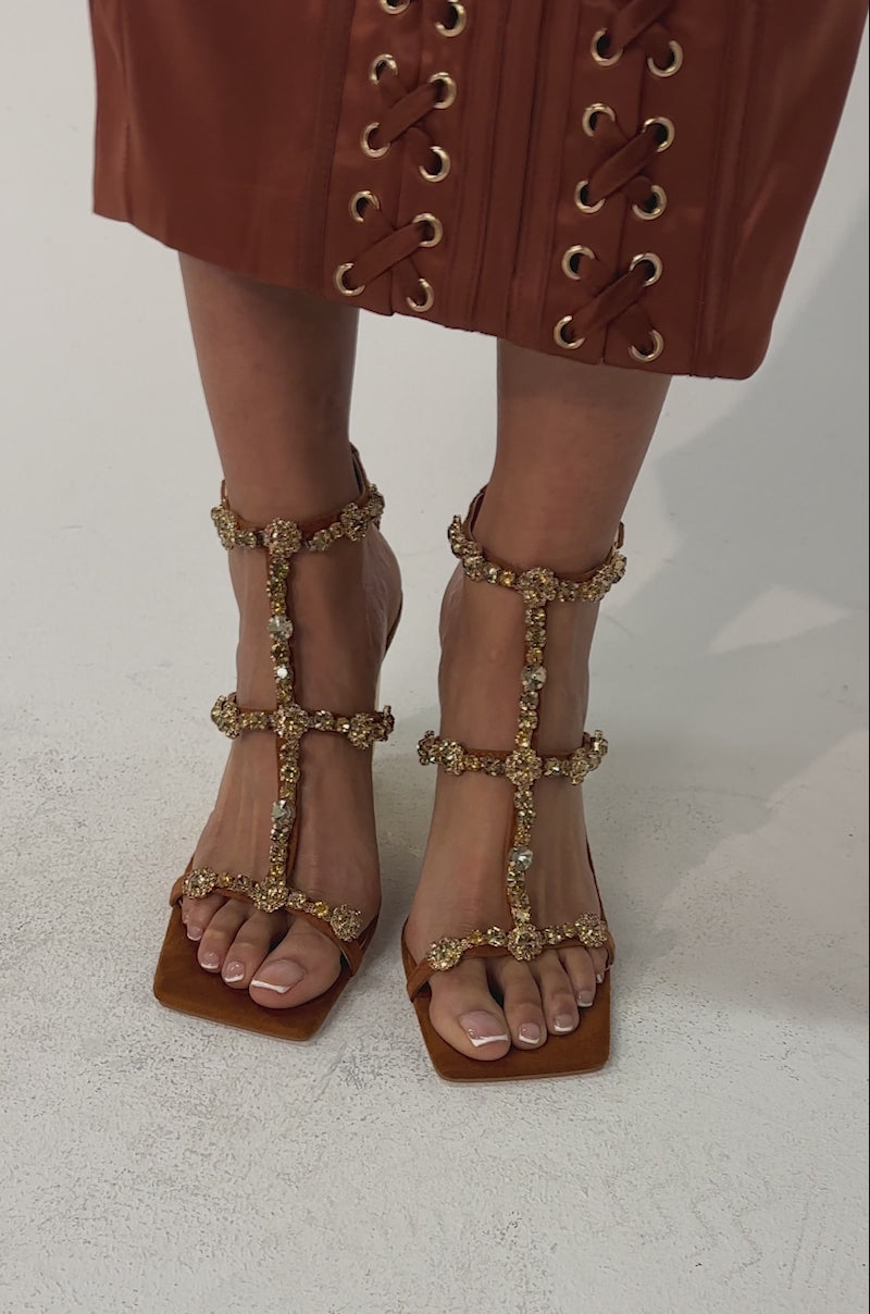 Video of woman modeling the AZALEA WANG SCHANTELLE Tan Embellished Upper Wedge Sandals with gold accents and a comfort cushion insole, standing against a light background.