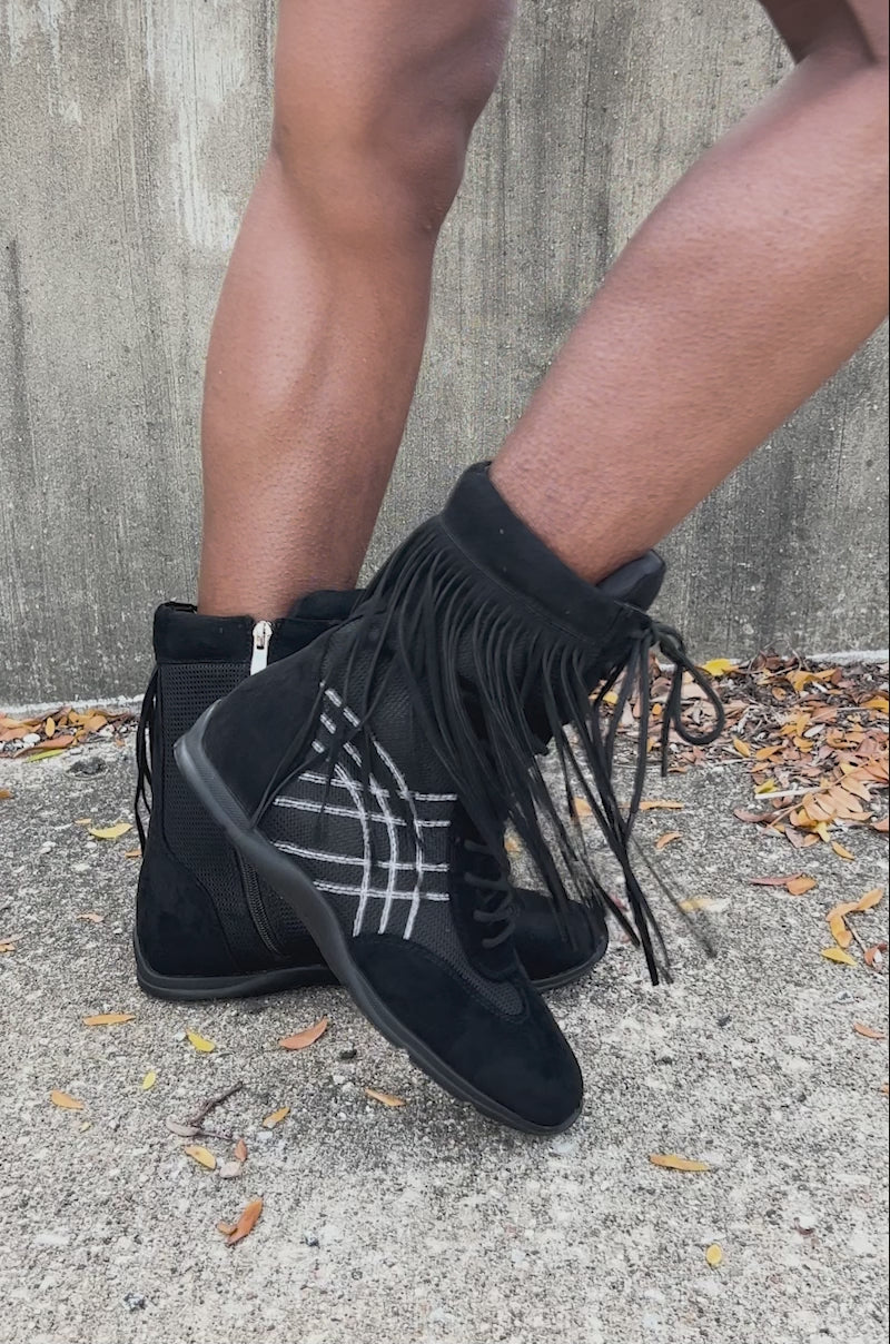Video of woman modeling the AZALEA WANG ZITHER BLACK FLAT FRINGE BOOTIE