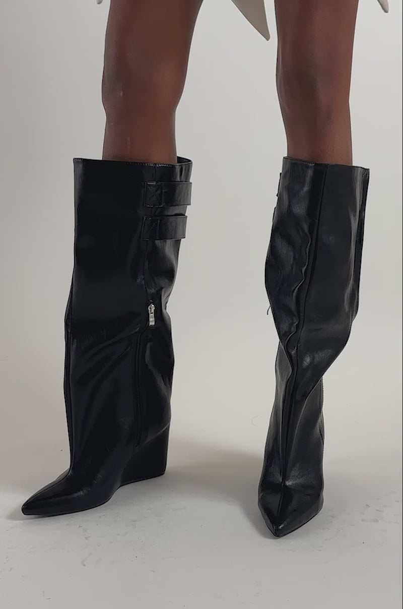Video of a woman modeling the AZALEA WANG THEA BLACK PU WEDGE BOOT.