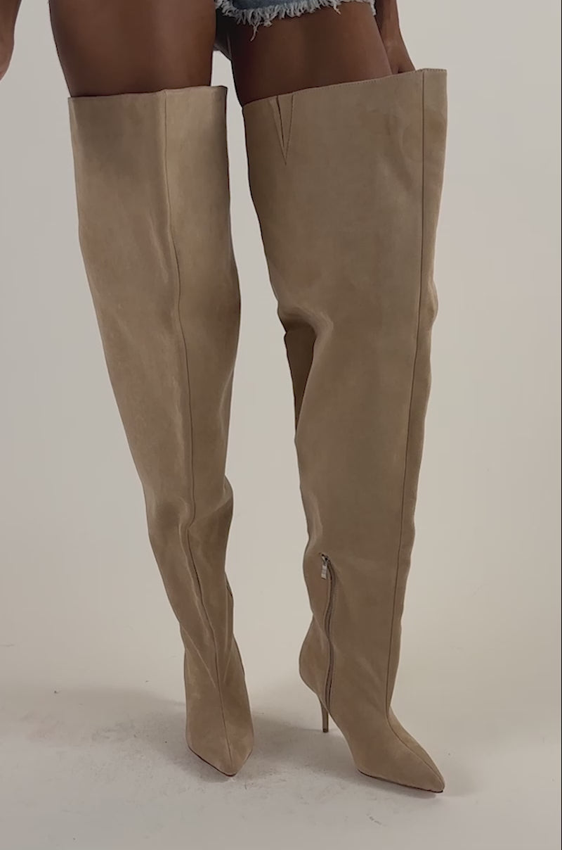 Video of a woman modeling the AZALEA WANG Halina Nude Faux Suede Thigh High Boot—oversized stiletto boots with pointed toes.