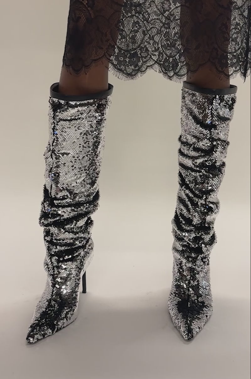 Video of a woman modeling the AZALEA WANG OLETHA SILVER SEQUIN STILETTO BOOT.