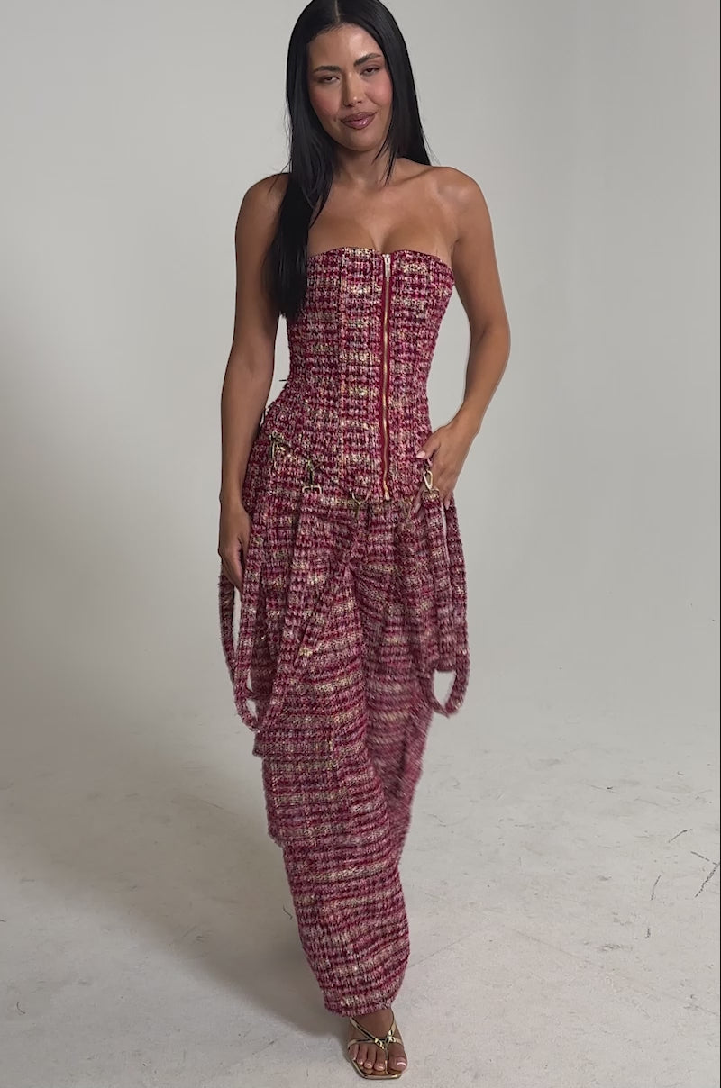 Video of woman modeling the ITS TIME TWEED CORSET, a strapless zip-up tweed top with metallic threads, paired with matching pants. She has long straight hair and a subtle smile.