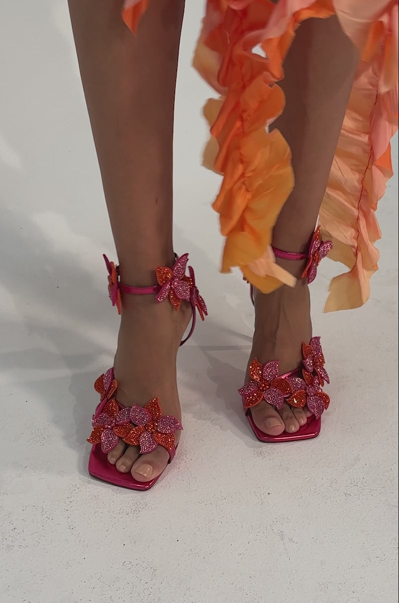 A video of a person wearing the AZALEA WANG NERIYA Pink Rhinestone Flower Stiletto Sandal.