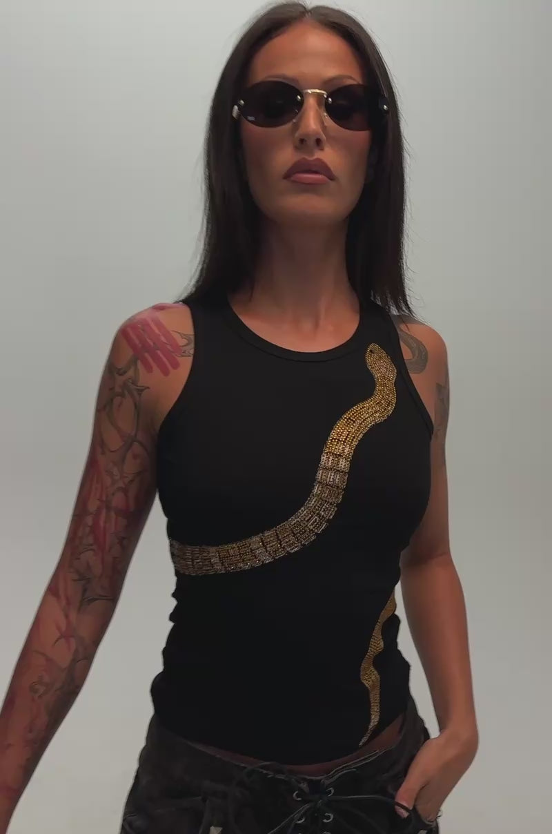 Video of a woman modeling the LIL SNAKE TANK. 