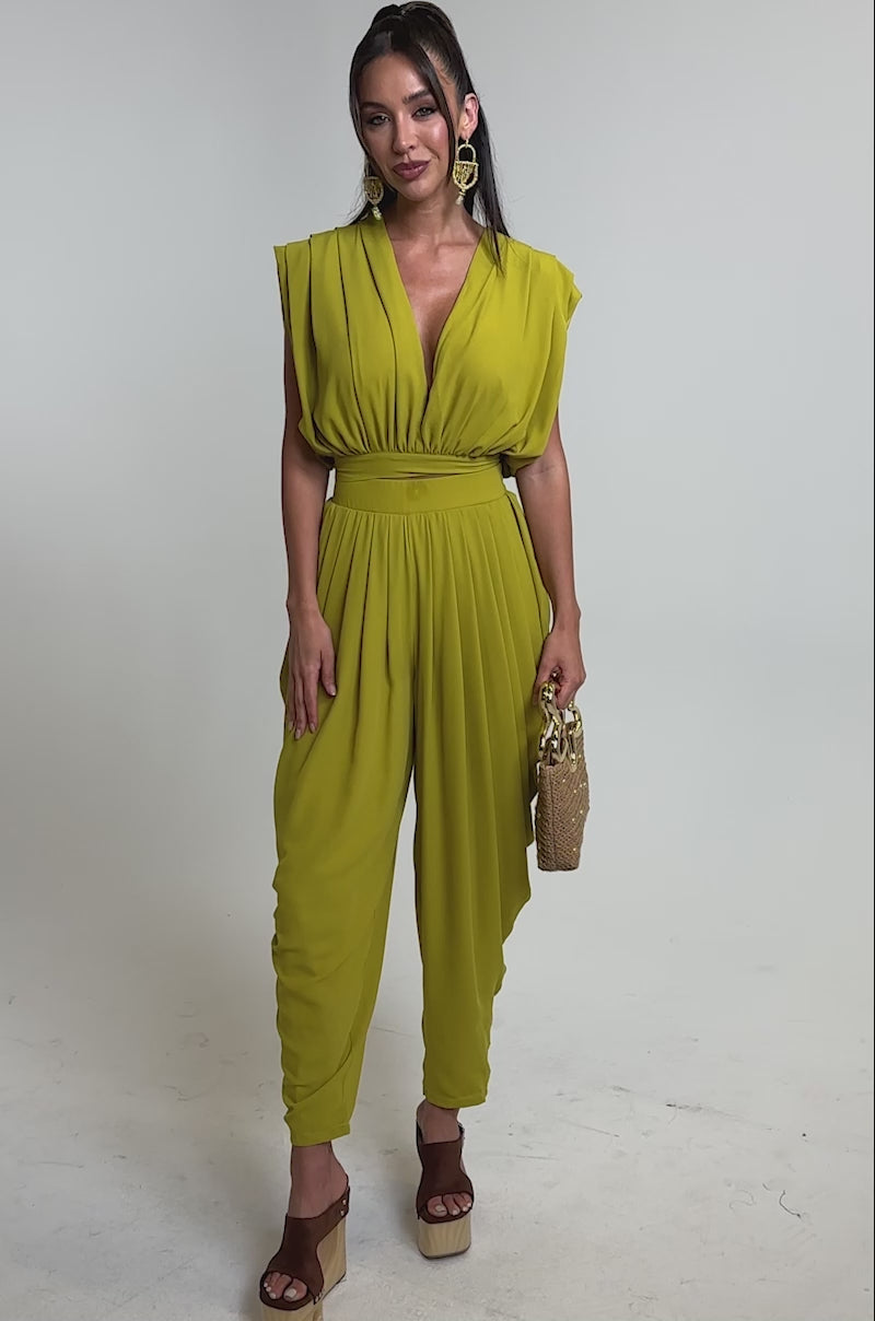 A video of a woman wearing the READY TO DANCE SLINKY PANT IN CHARTREUSE.