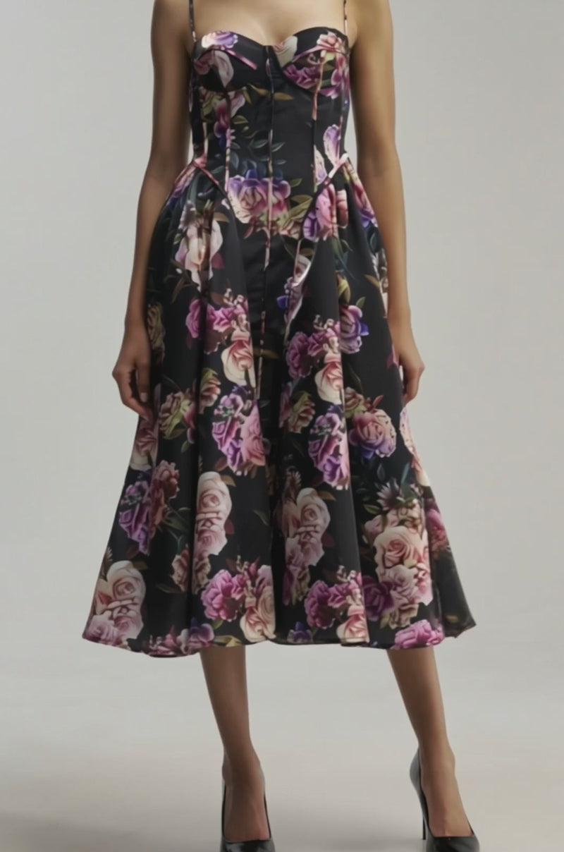 Video of a woman modeling the FEELING FLORAL MAXI DRESS IN PINK MULTI with spaghetti straps.background.