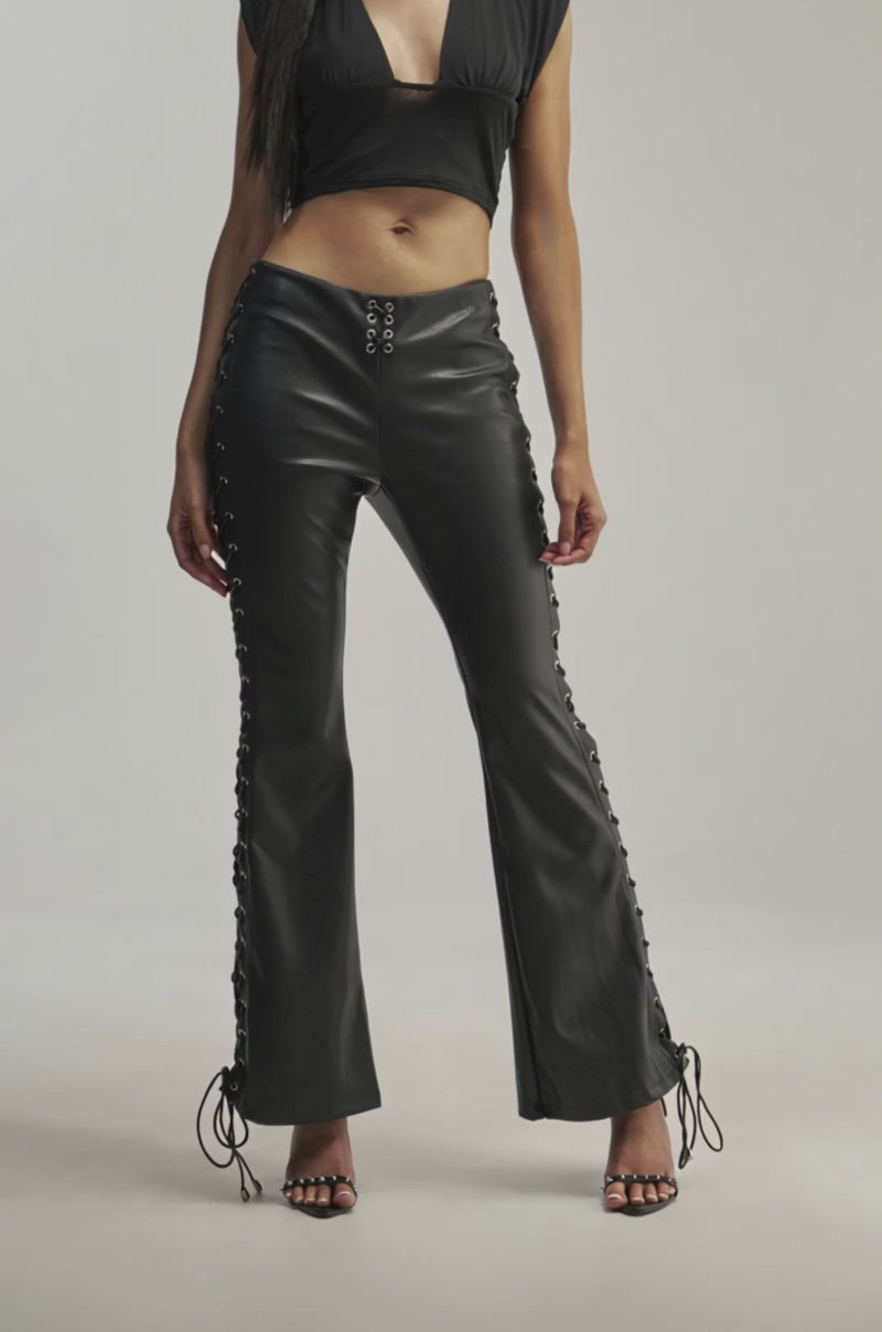 Video of a woman modeling the LACED UP FAUX LEATHER PANT.