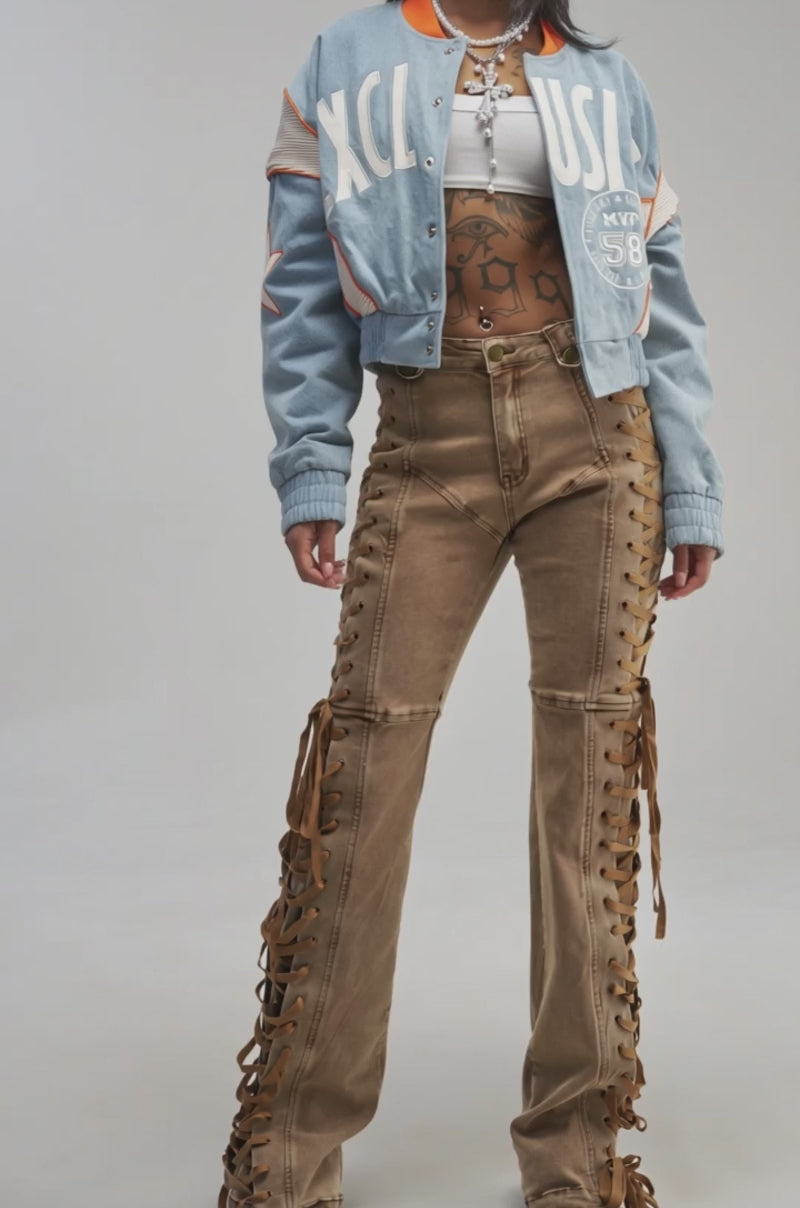 Video of a woman modeling the INVITE ONLY DENIM VARSITY BOMBER.